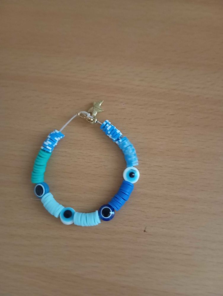 bracelet oeil et perles bleues avec une attache �toile dor�e 3 Le Haillan (33)