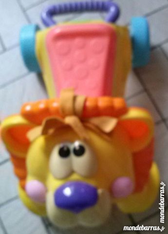 pousseur fisher price lion