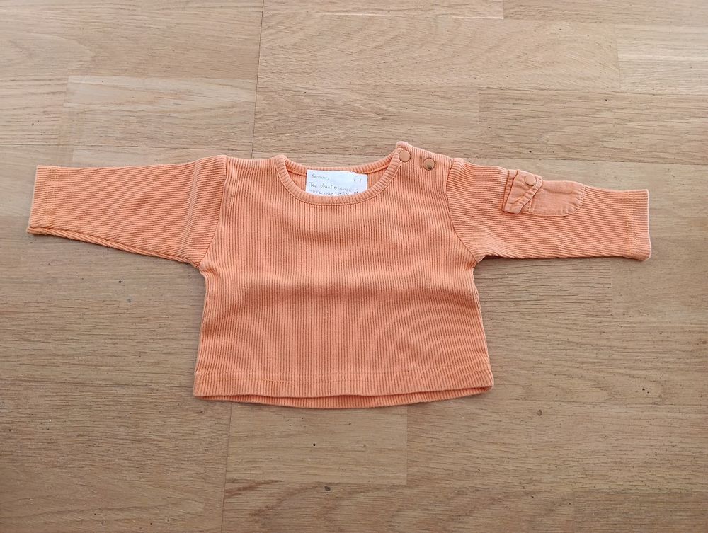 F 13 (14) - 3 mois - Tee-shirt orange avec poche 0 Paris 13 (75)
