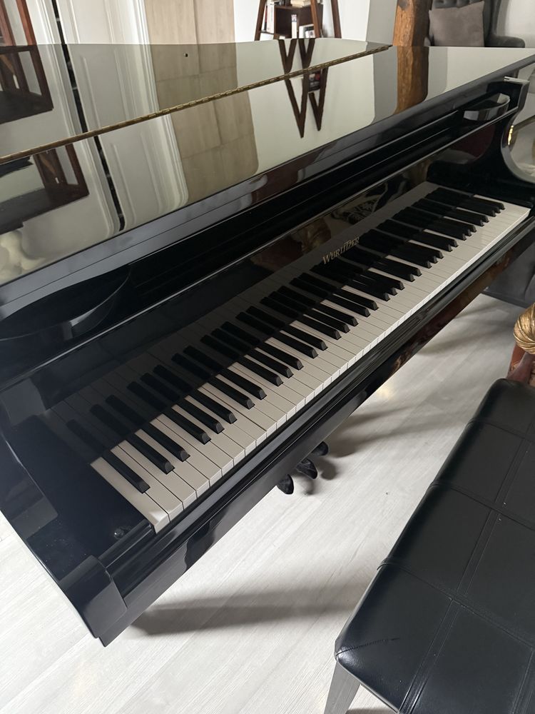 un piano � queue Wurlitzer,
Mod�le : C153 9000 Saint-Sulpice (60)