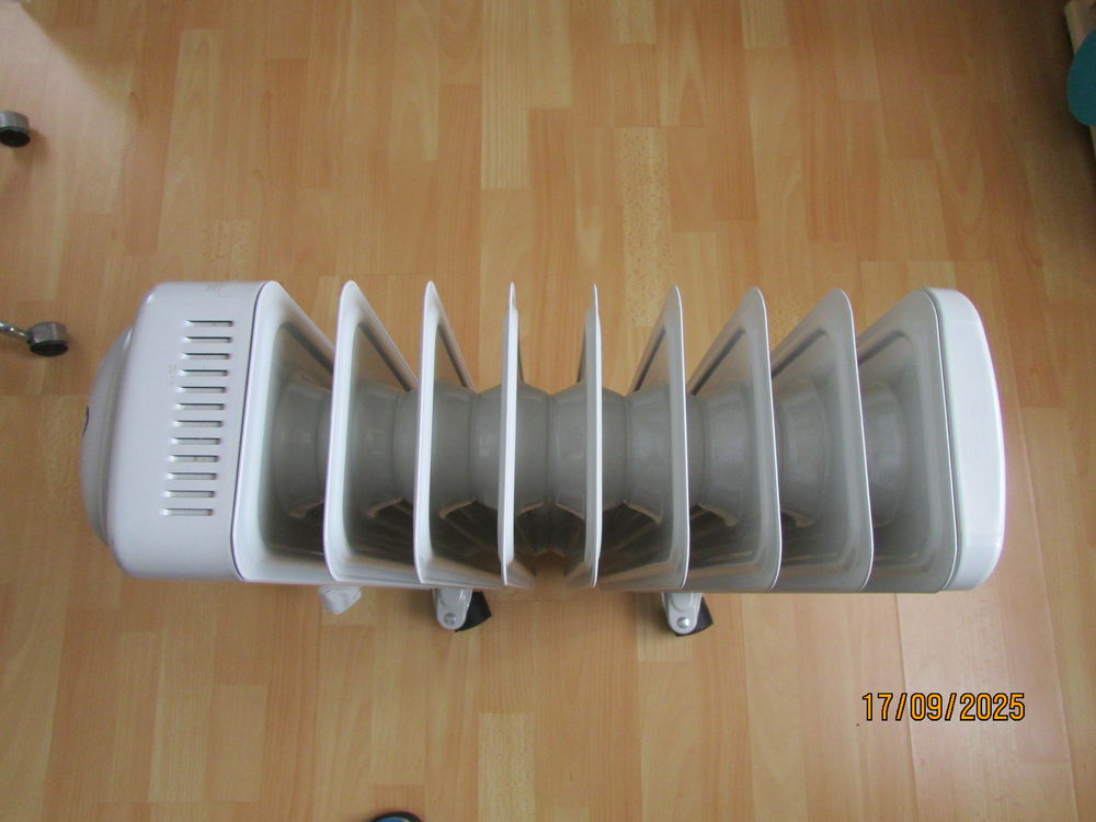 Radiateur �lectrique � circulation d'huile. 
40 �pernay (51)