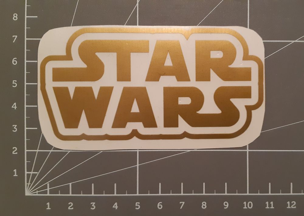 Sticker logo  STAR WARS  (COULEUR NOIR, ARGENT� ET OR) 5 Le Mans (72)