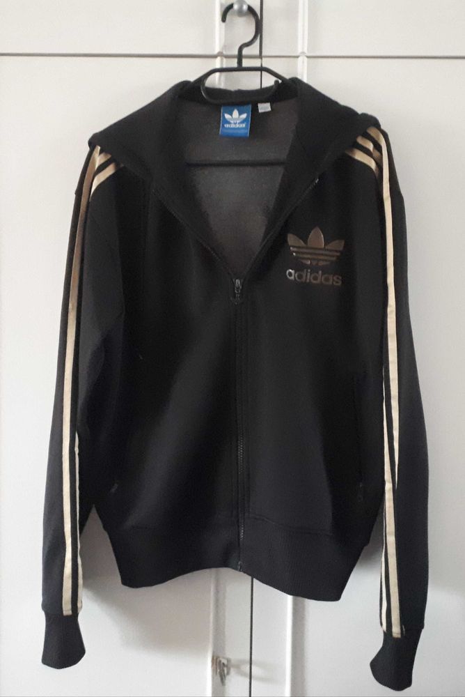 Veste Adidas � capuche noir et dor�e M 35 Villemomble (93)