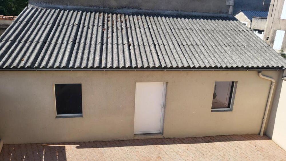 Maison sur étage avec garage et cour centre ville