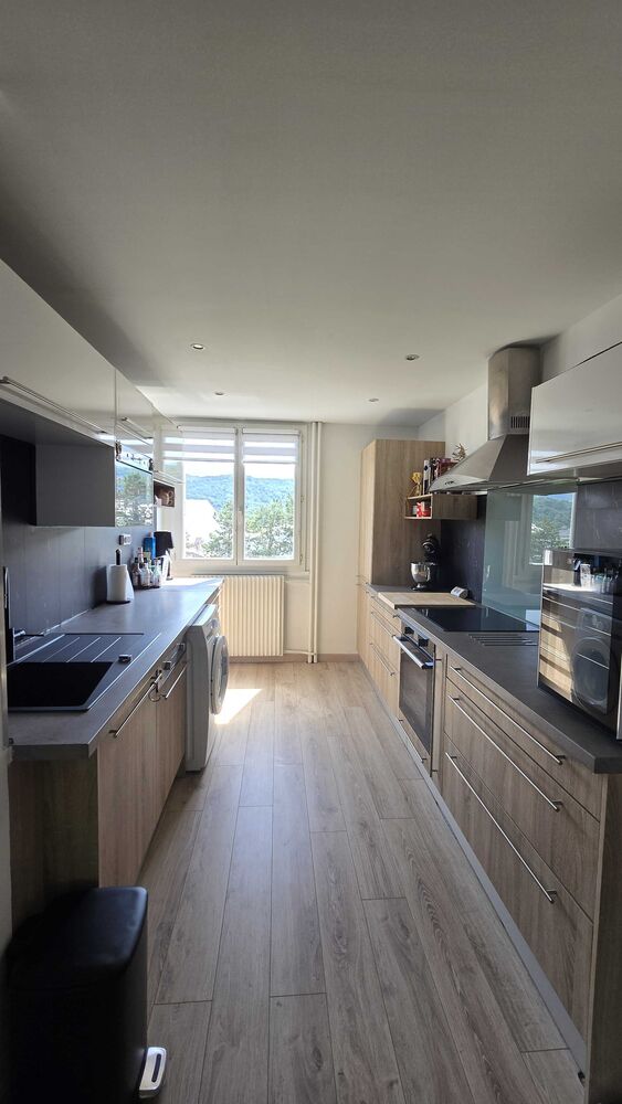 T3 rénové 63 m² avec balcon, parking privé, cave, clim, ascenseur