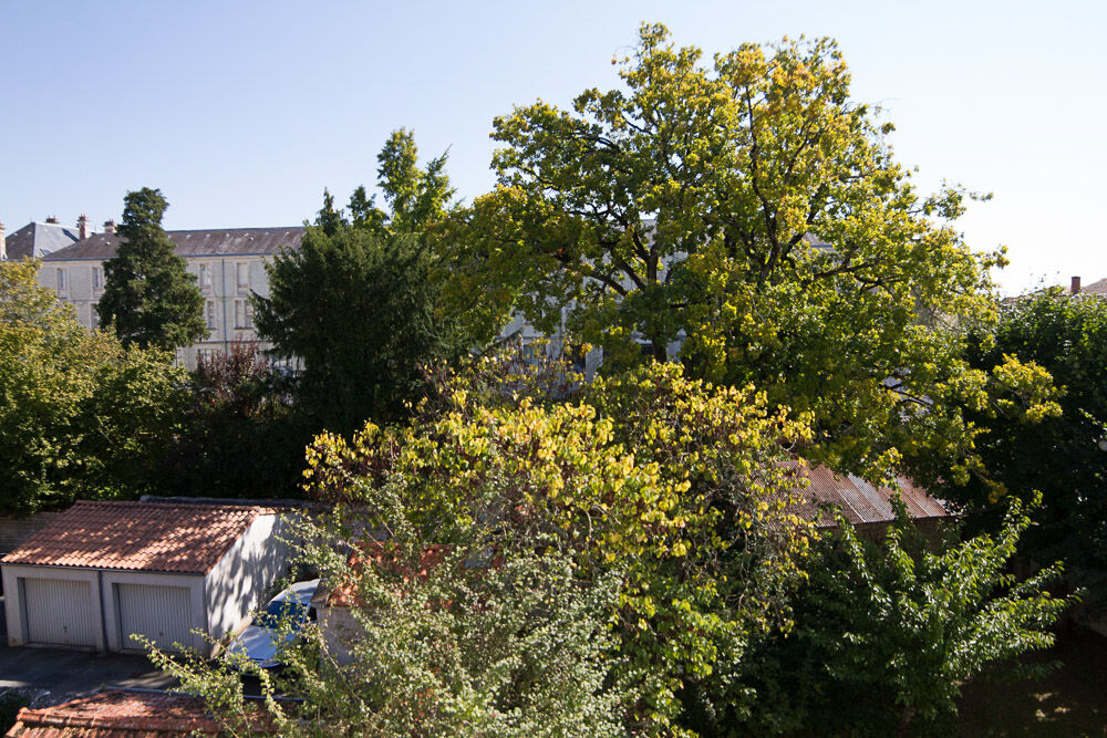 Appartement 70 m² / Garage / Jardin commun