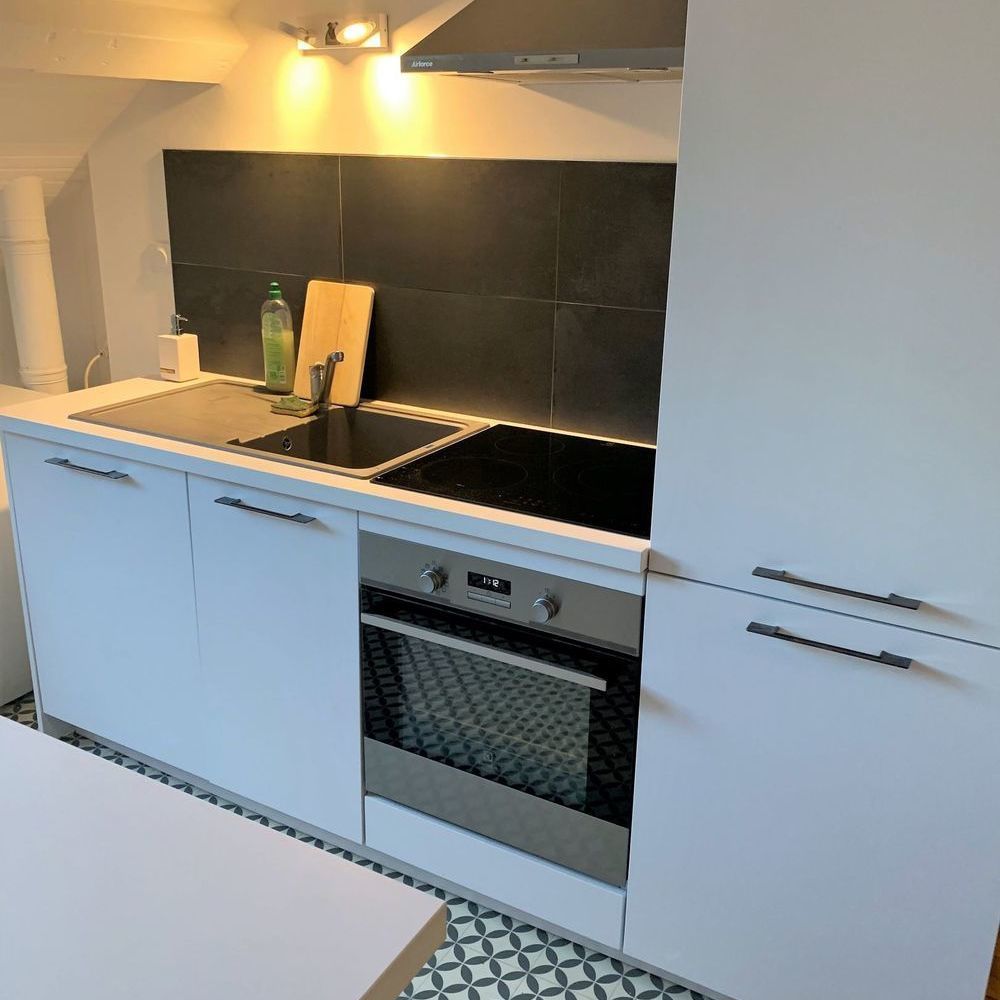 séjour/salle à manger de 25m², cuisine ouverte/équipée