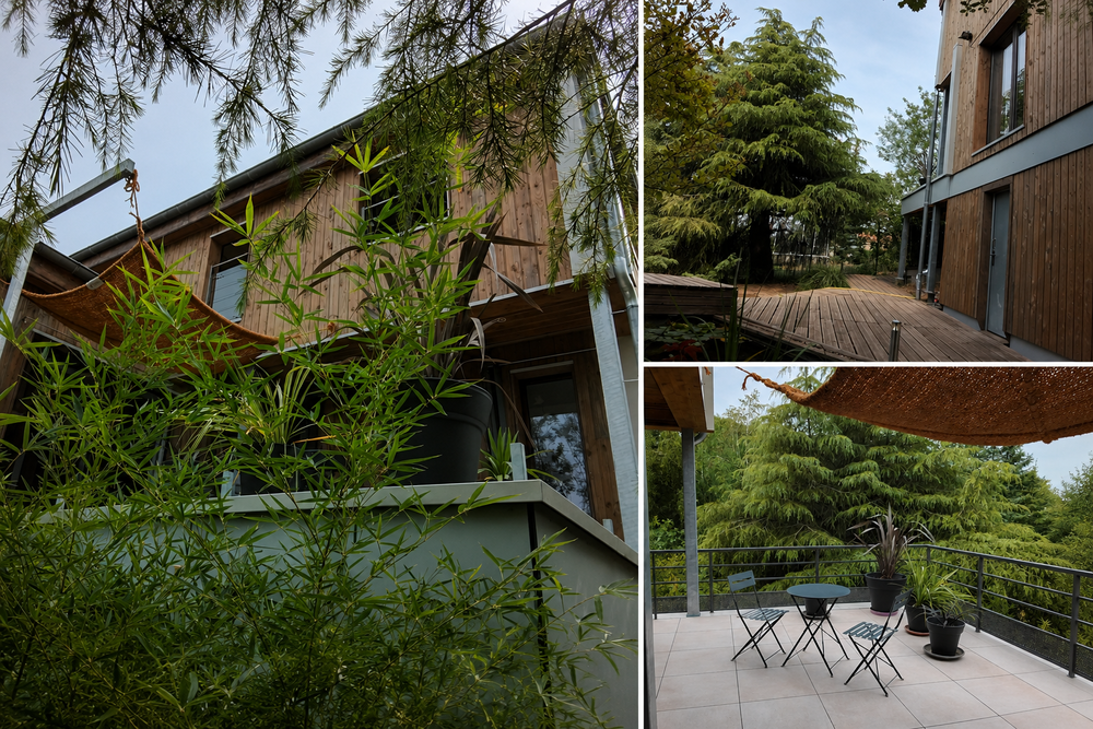 Maison en bois au coeur d'un parc paysager .