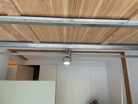 Porte de garage en bois motorisée SOMFY 400 Barbizon (77)